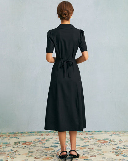 Das schwarze V-Ausschnitt-Knopf Puffärmel Midikleid